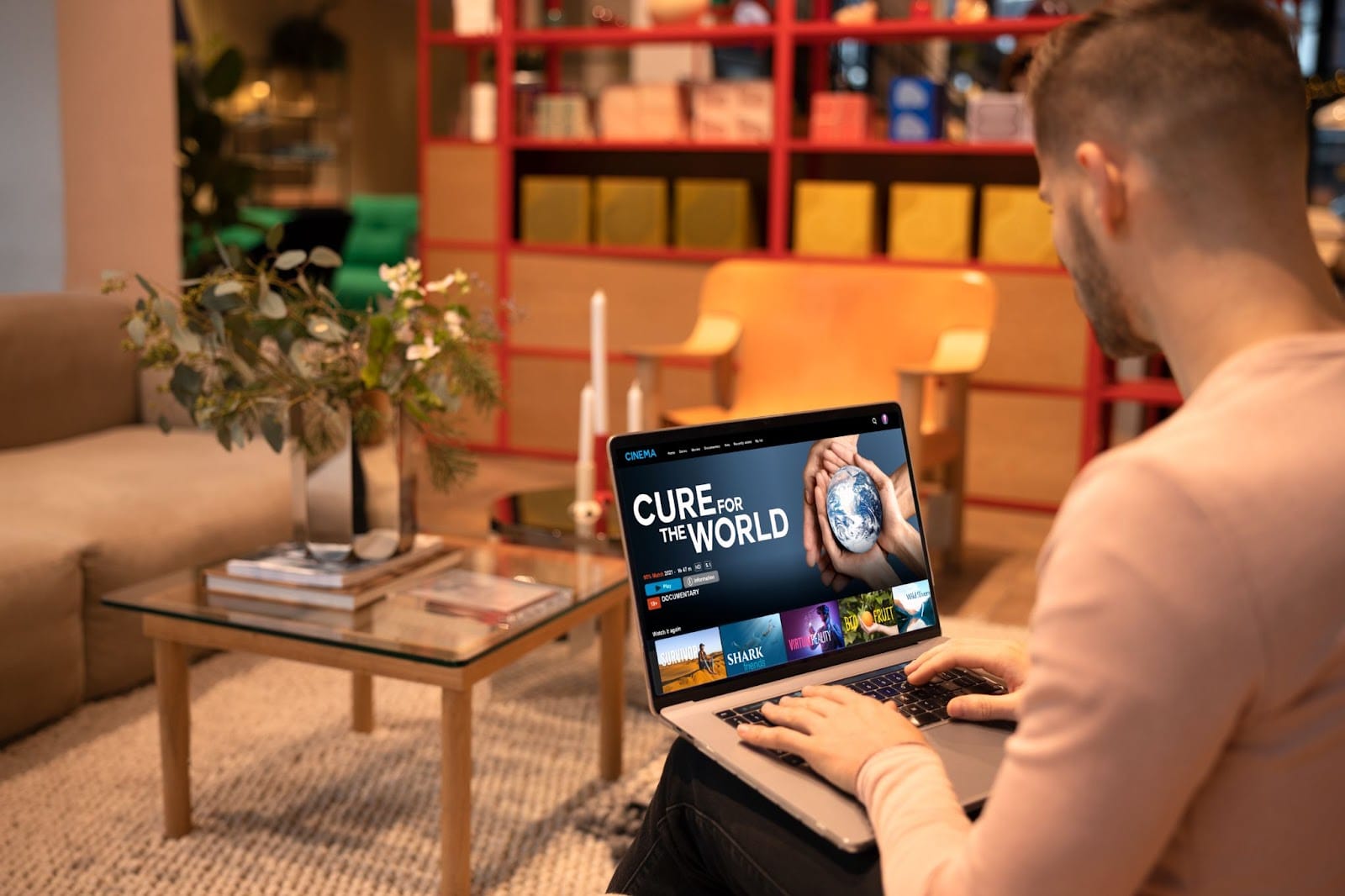 Man watching a product demo on his laptop