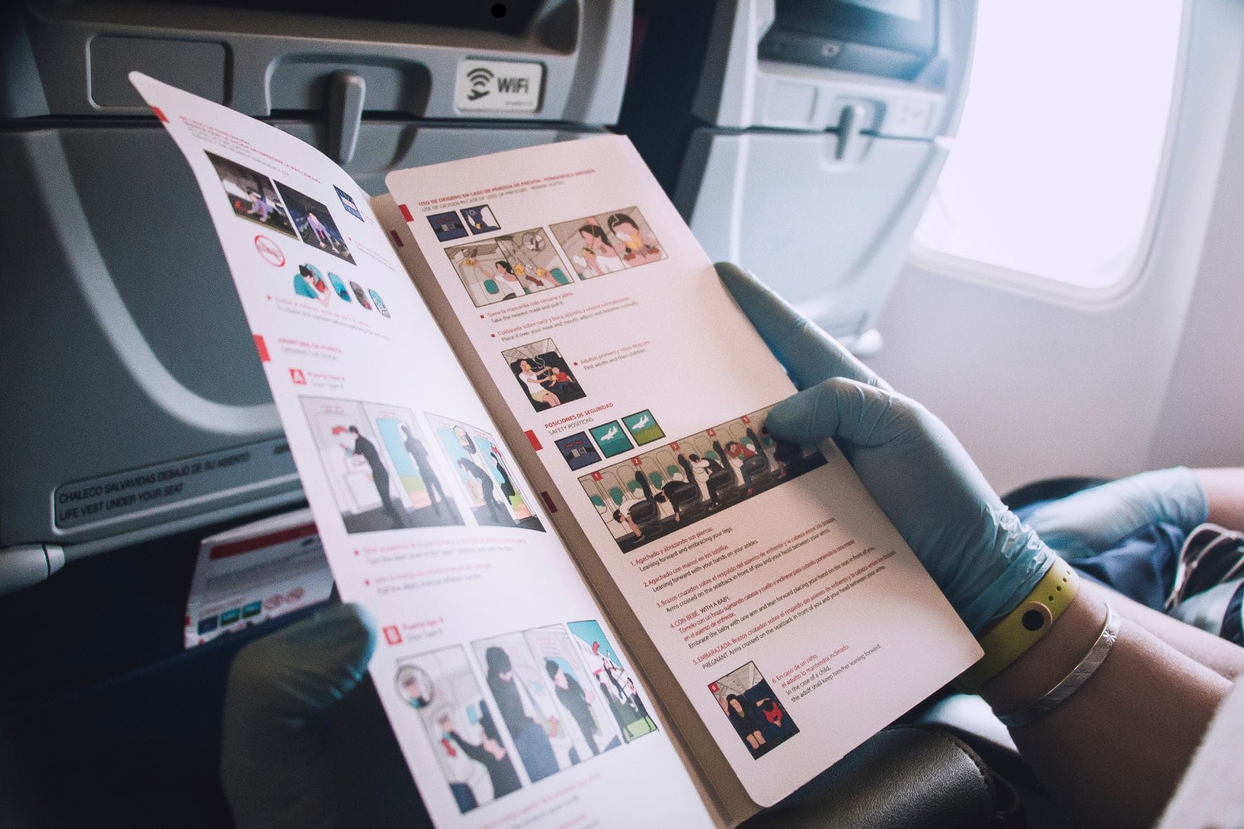 man looking into a detailed brochure. 