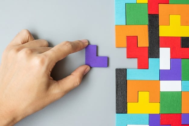 Hand connecting geometric shape block with colorful wood puzzle pieces