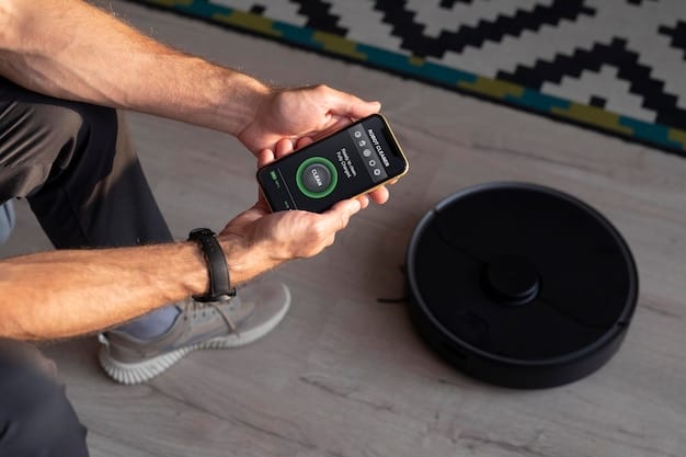 Man controlling a robot vacuum with his phone