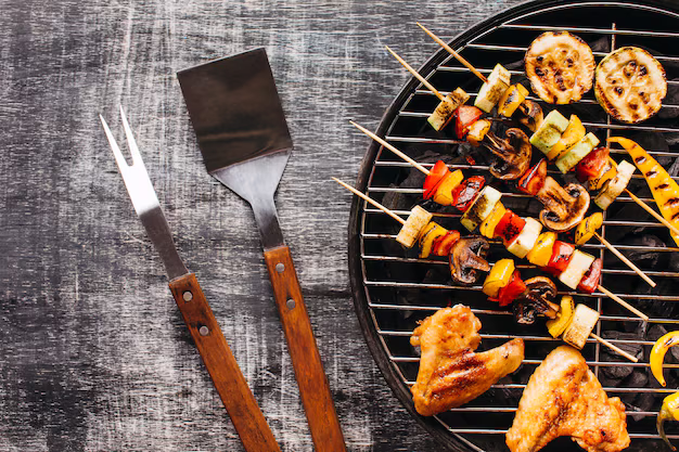 grilling utensils with food skewers