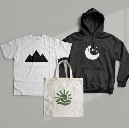 Screen printed t-shirt, hoodie, and tote bag laid flat showing bold graphic prints on cotton fabric