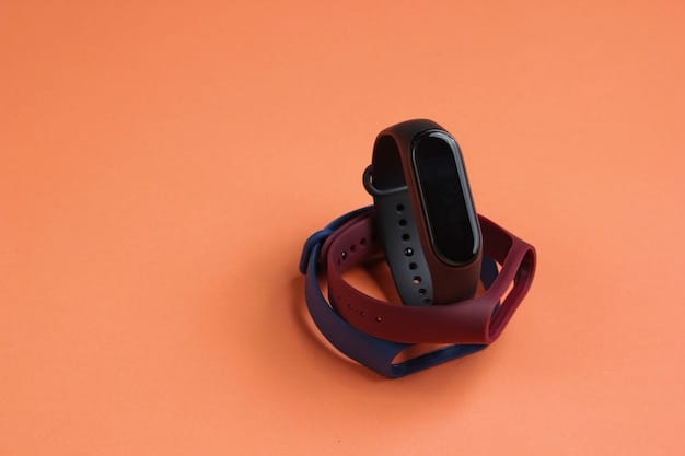 Smart watch with interchangeable bracelets on coral color background. Fitness tracker. Modern gadgets