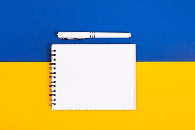 A white notepad with a place to insert text and a white pen against a blue and yellow background Copy space Mockup