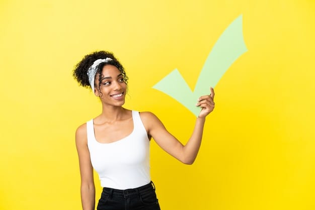 Young african american woman isolated on yellow background holding a check icon with happy expression
