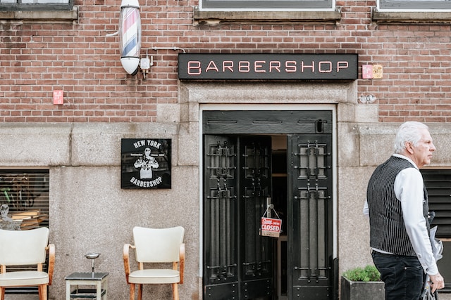How can emerging barber shops effectively market their unique services?