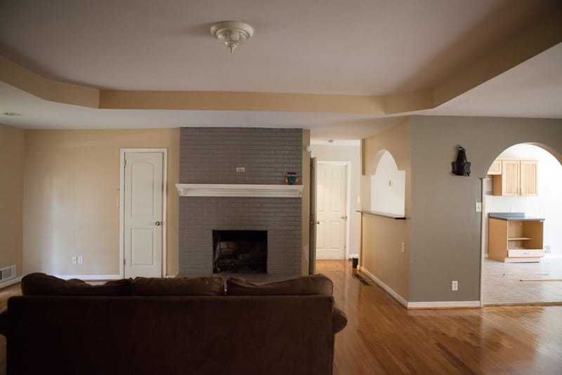 The main hosting area. L to R: living room, kitchen, dining room. The door in the center leads into the 