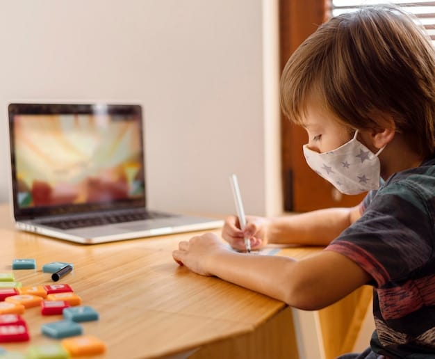 Free Photo boy wearing medical mask and attending virtual school