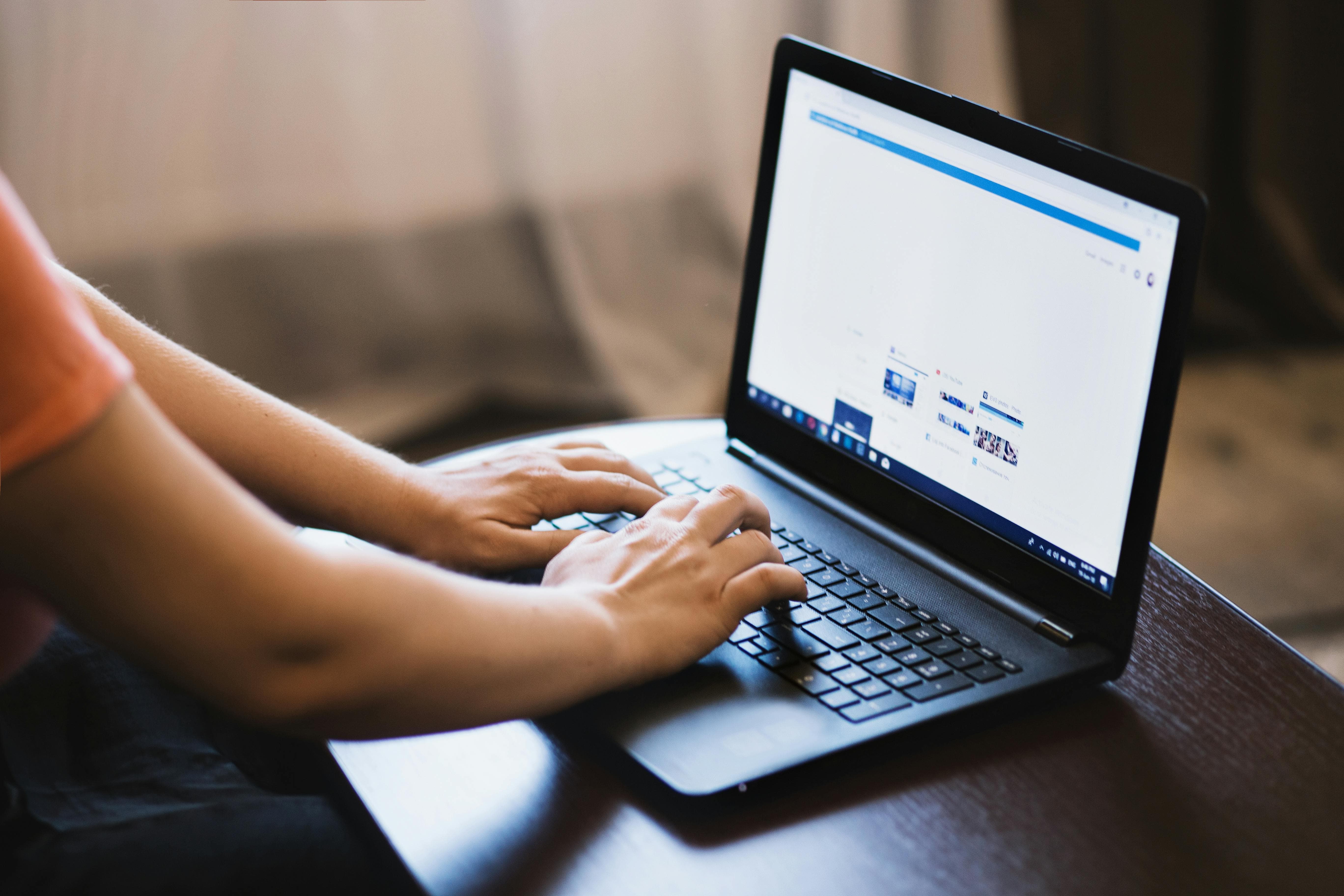 Photo of a person typing for a blog on should or shouldn't you delete bad comments on social mediaby EVG Kowalievska: https://www.pexels.com/photo/person-typing-on-laptop-1174775/