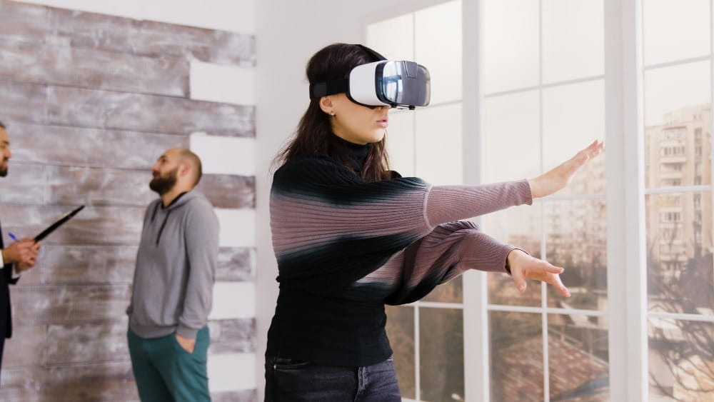 A woman using VR in an empty apartment