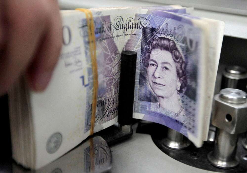 Sterling falls 1% versus dollar, rises against euro