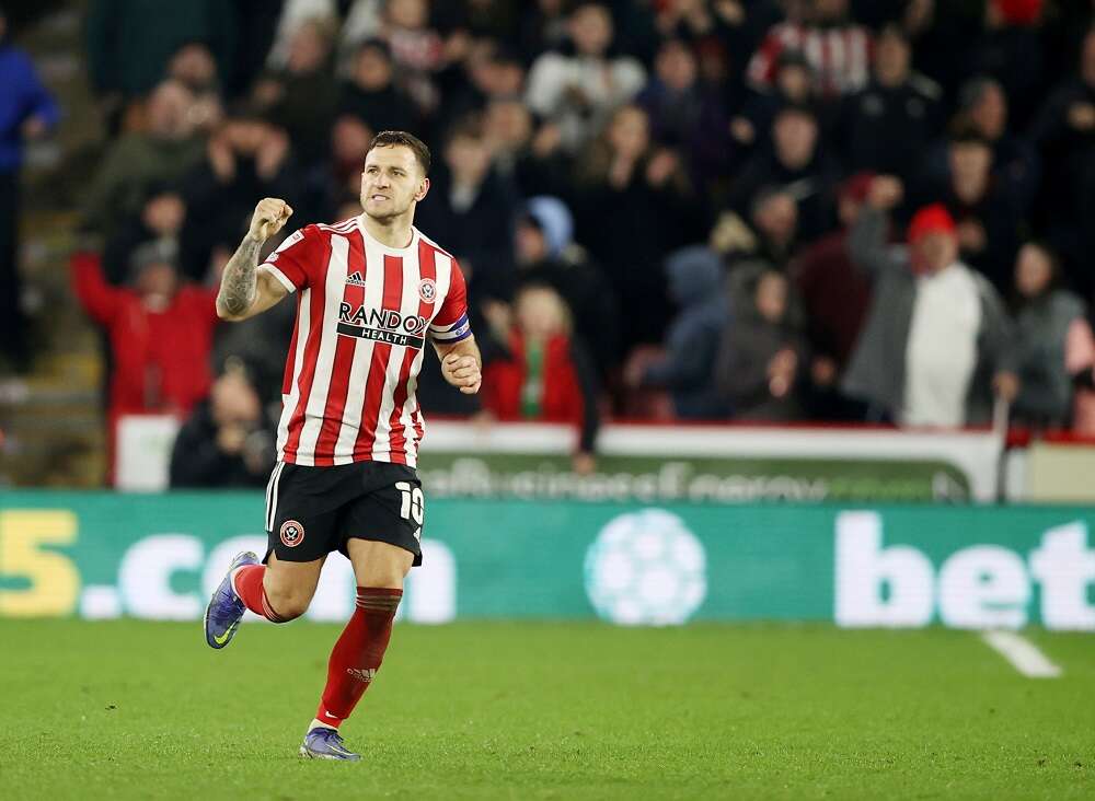 Soccer-Police arrest man after Blades skipper Sharp attacked