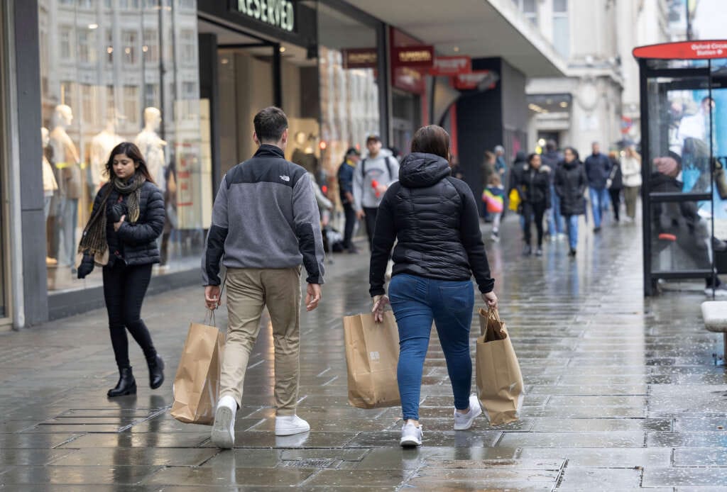 British consumers curb their shopping in rainy July