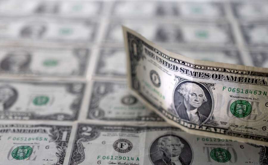 U.S. dollar climbs to two-year peak as risk appetite tumbles; yuan drops