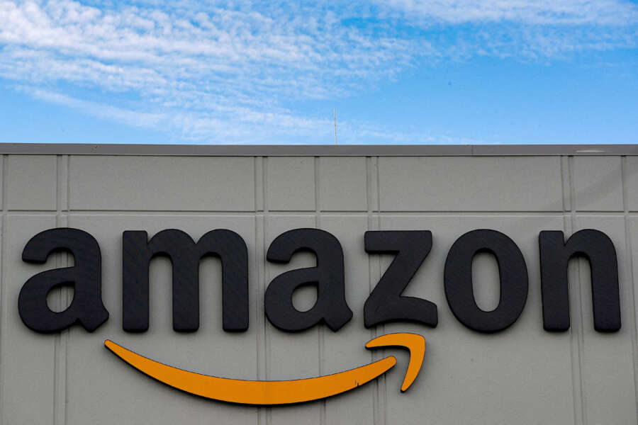 Amazon.com to invest over 1 billion euros in European electric van, truck fleet