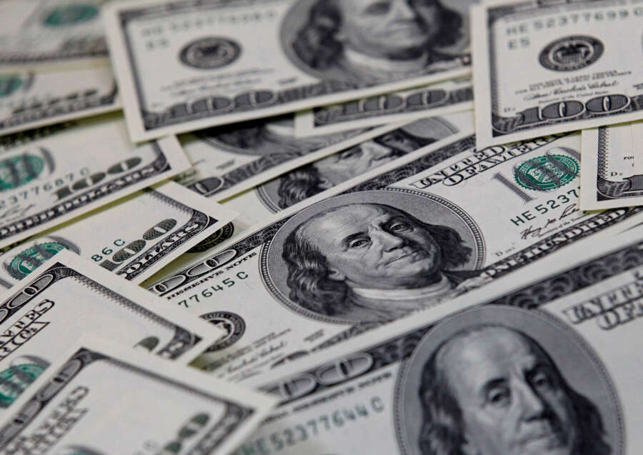 Dollar creeps up in subdued start to new year