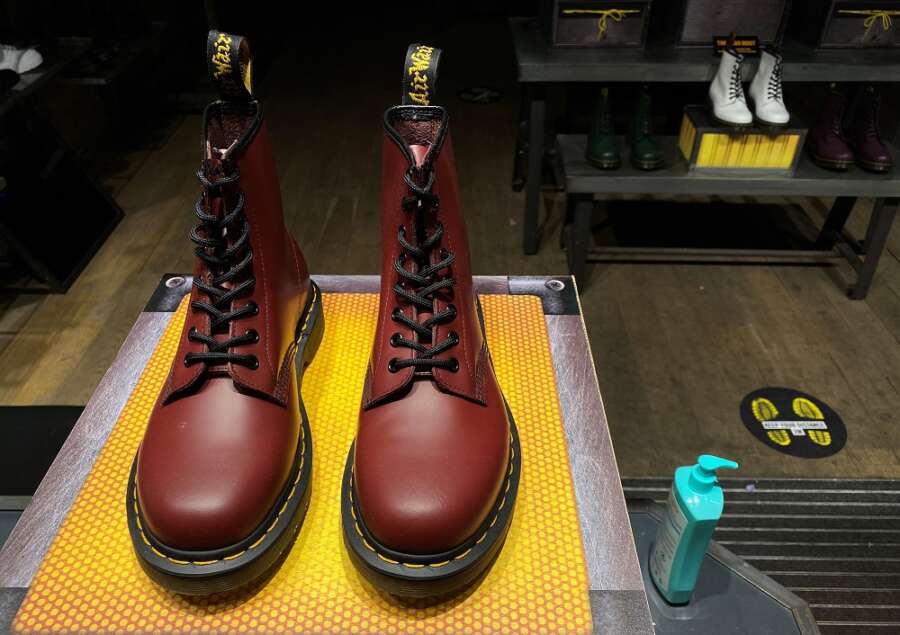 Bootmaker Dr Martens warns on profit as finance chief walks