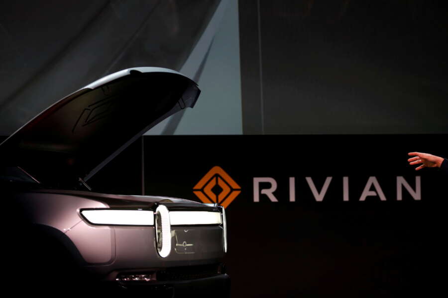EV maker Rivian prices IPO above range to raise over $11.9 billion