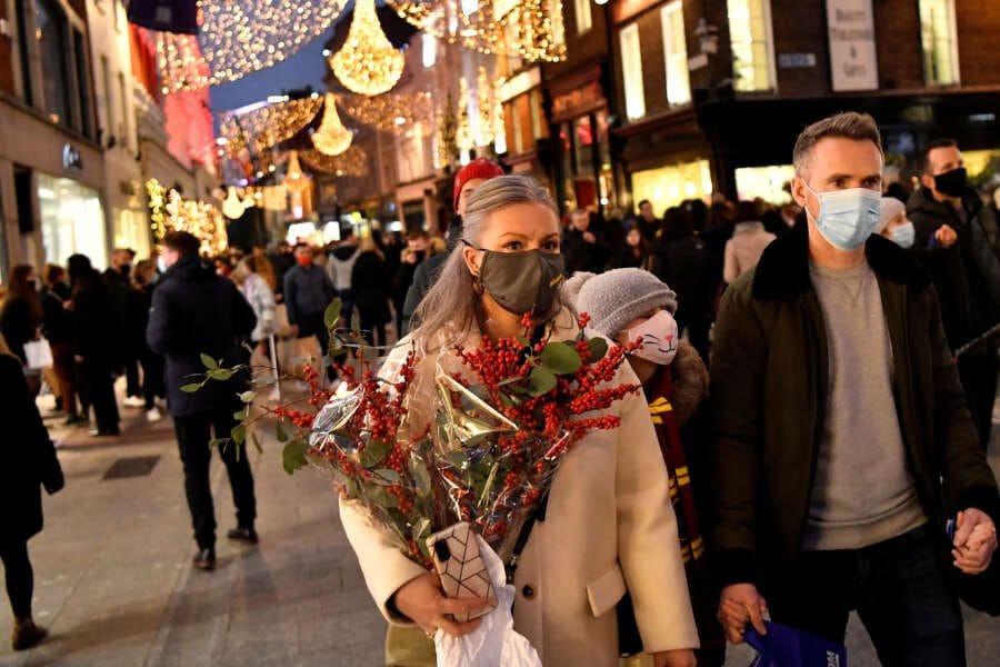 Heavy winter sweaters, coats pile up at stores as warm weather threatens holiday shopping season
