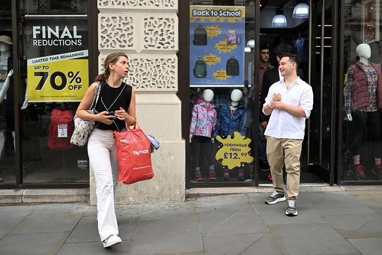 Summery weather helps boost UK consumer spending, surveys show