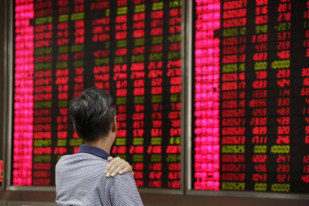 Global shares edge lower on new COVID-19 outbreaks in Asia