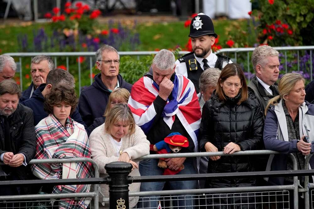 Huge crowds follow queen’s funeral in silence and awe