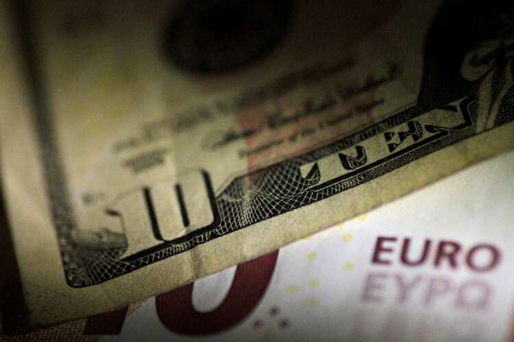 Dollar edges higher as market awaits clues from U.S. Fed