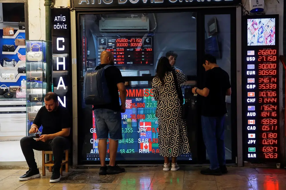 Dollar mixed in tight trading range before Fed statement