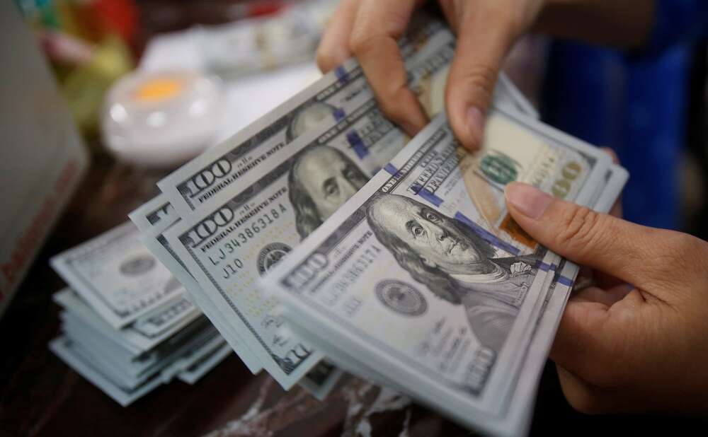 Dollar hits 20-yr high as yen tumbles on dovish Bank of Japan