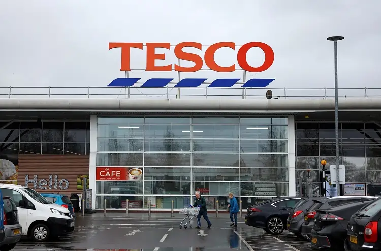 Britain’s Tesco lifts annual profit forecast after strong first half