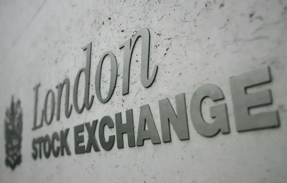 London stocks end higher for third month