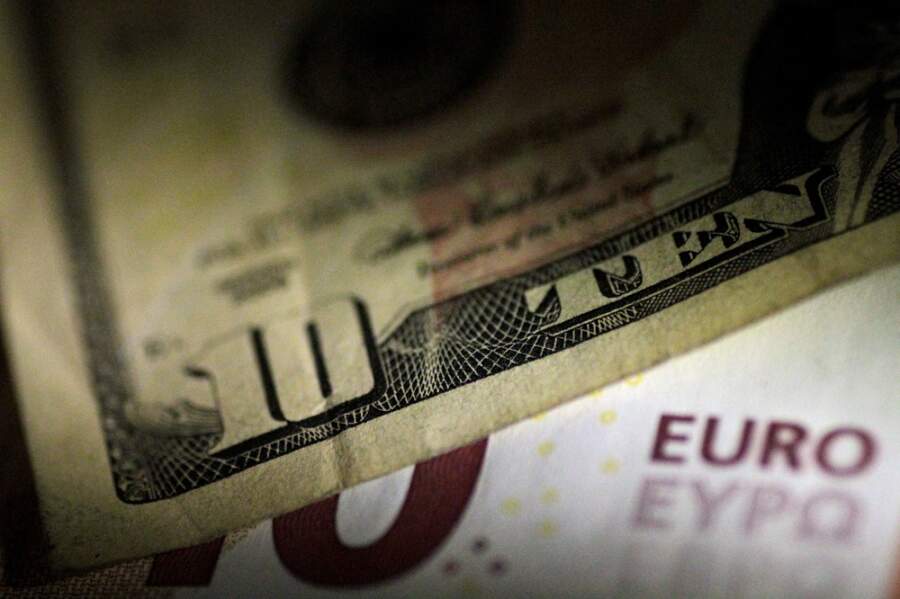 Dollar edges higher as market awaits clues from U.S. Fed