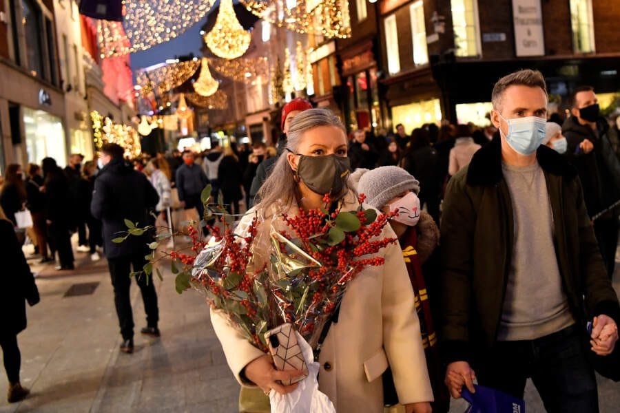 Heavy winter sweaters, coats pile up at stores as warm weather threatens holiday shopping season