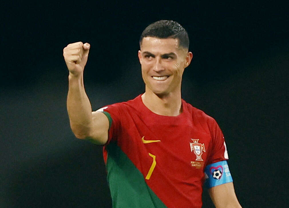 Soccer-Ronaldo breaks record as Portugal up and running with Ghana win