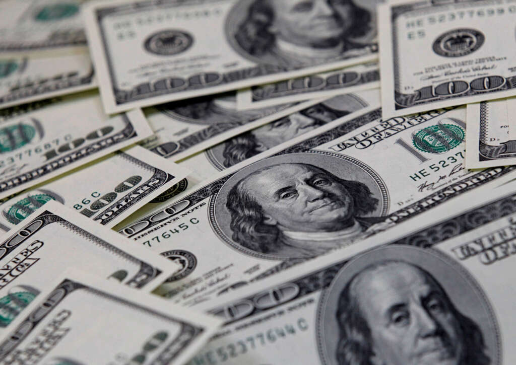 Dollar creeps up in subdued start to new year
