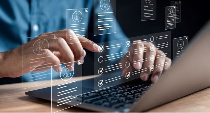 This may contain: a person using a laptop computer on a wooden table with icons and symbols overlaying the screen