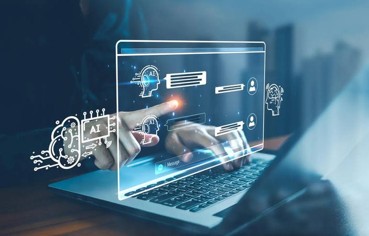 This may contain: a person using a laptop on a desk with icons coming out of the screen and pointing at them