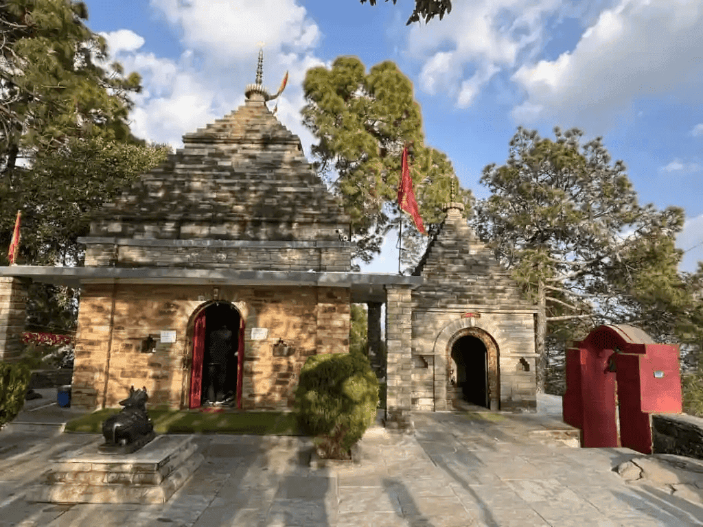 A photo of Kasardevi Temple, Almora (Uttarakhand), with shrines dedicated to Lord Bhairava acting as the Kshetrapala. A statue of Nandi faces the main temple’s entrance door.
