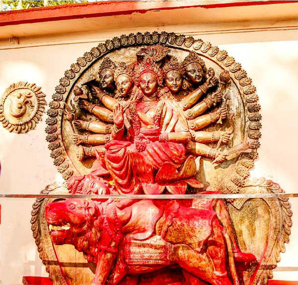 A photo of a sculpture of the Goddess at the Kamakhya Temple.