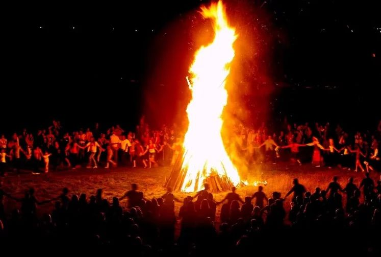 A photo of the sacred bonfire of Holika Dahan at night.