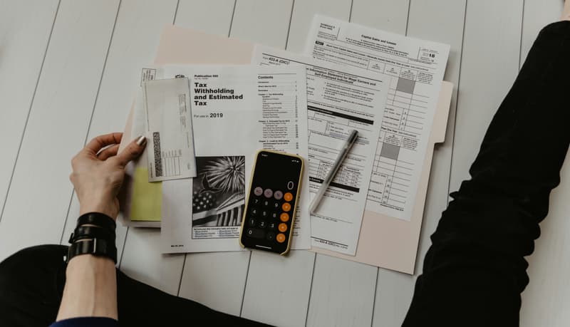 Reviewing finances and interest costs with a calculator