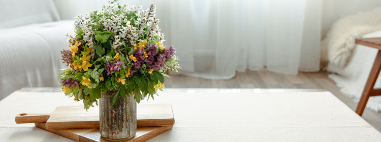 White, Yellow and Pink Flowers on a table