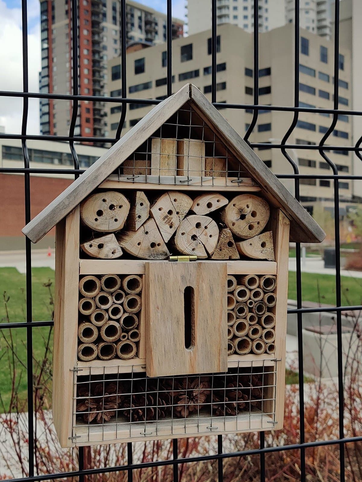 Wooden bee hotel on a post