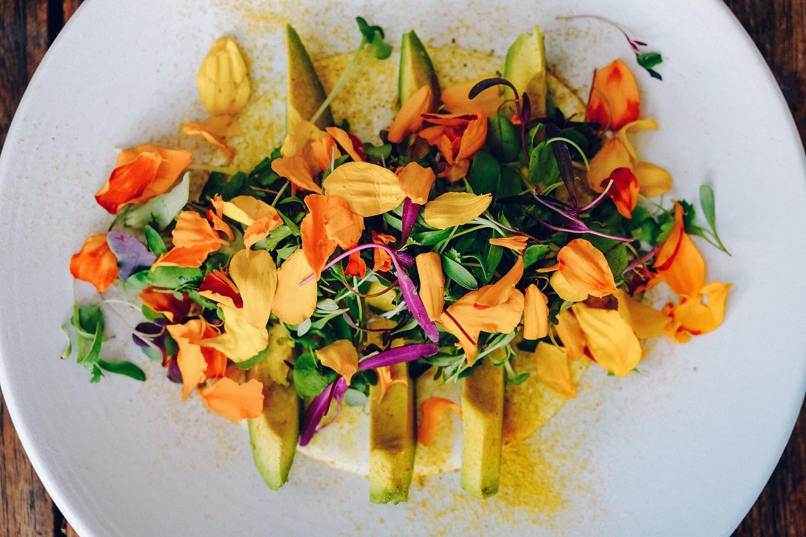Salad topped with edible flowers