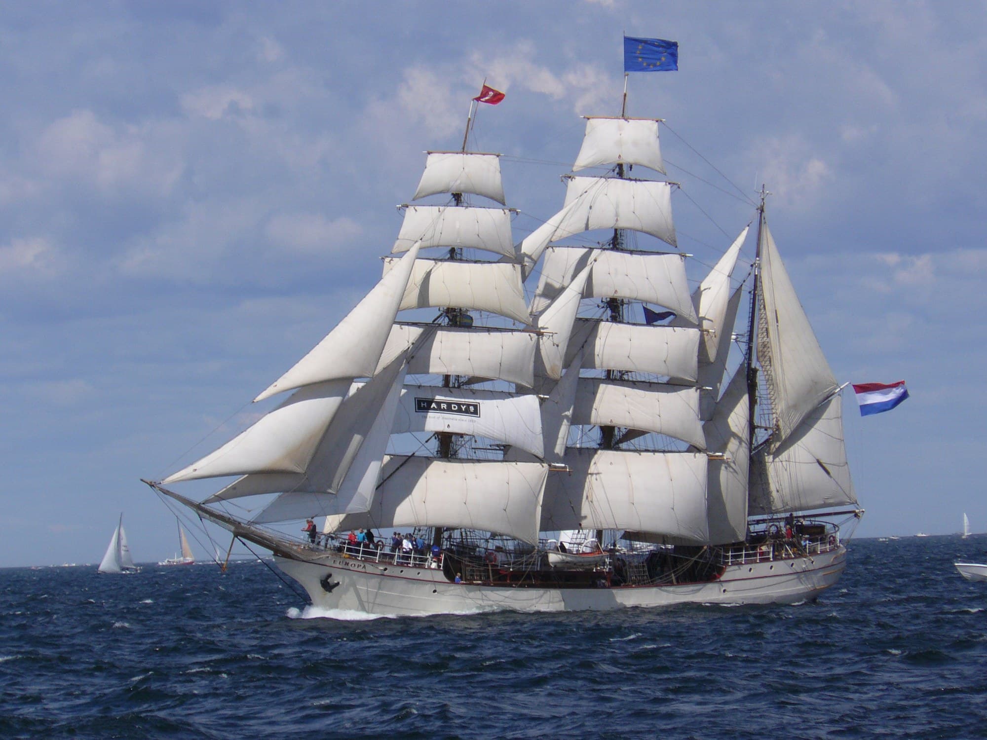 Tall ship under full sail at sea