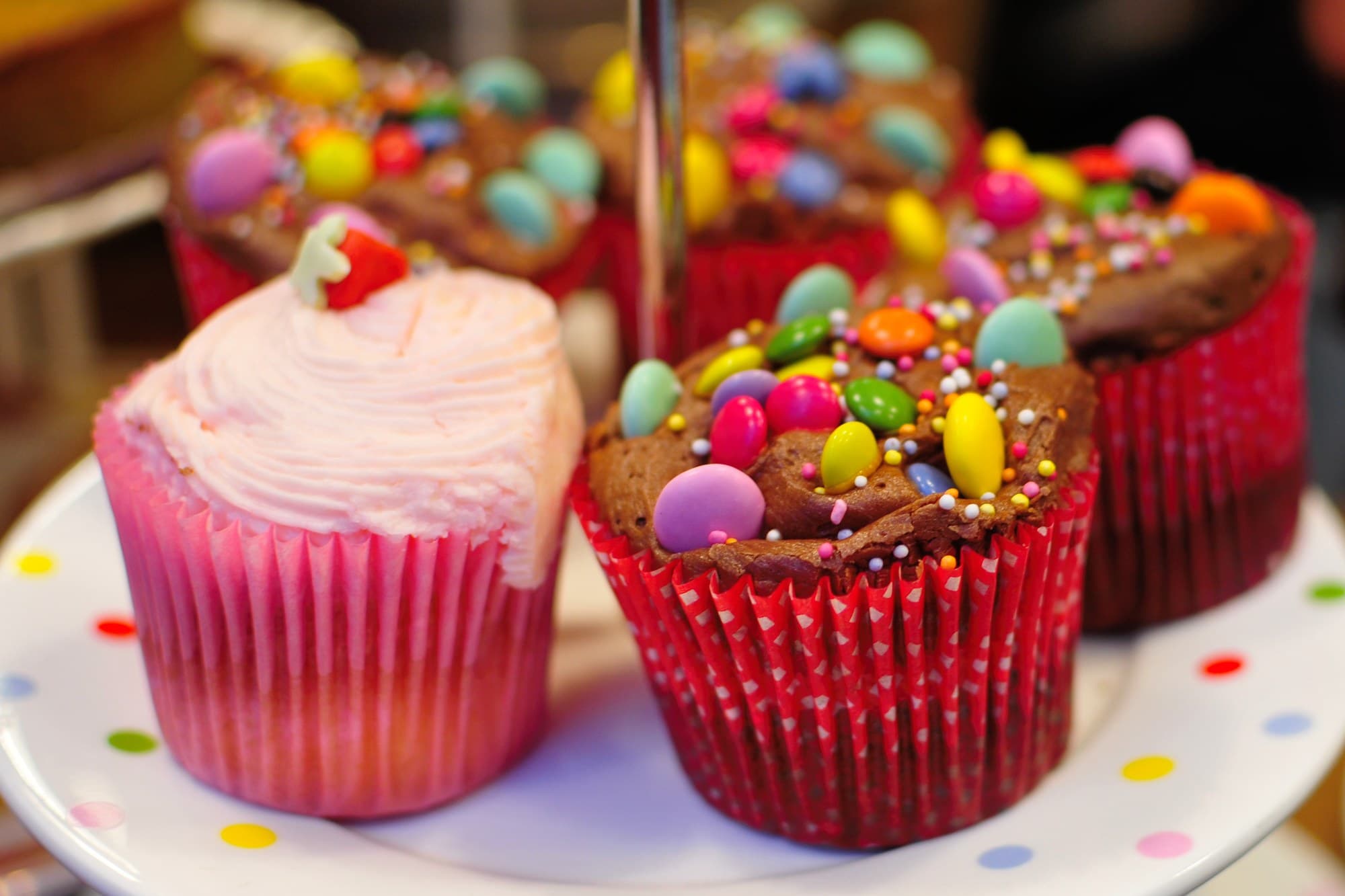 Colourful cupcakes topped with sweets