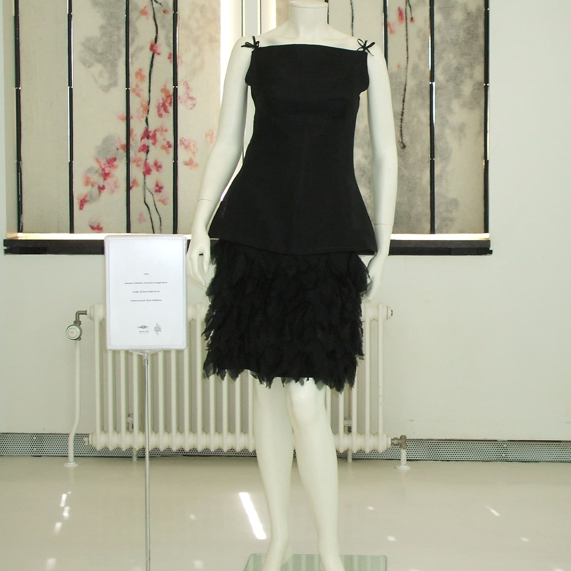 Simple black dress on a mannequin