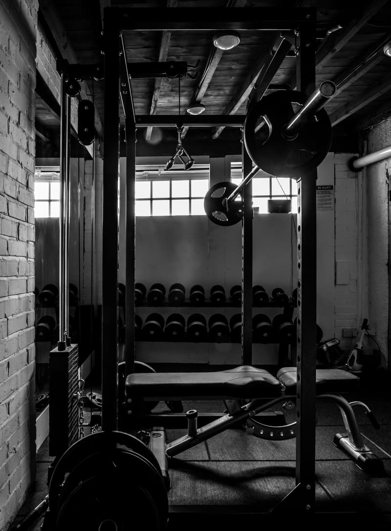 exercise equipments in grayscale photography