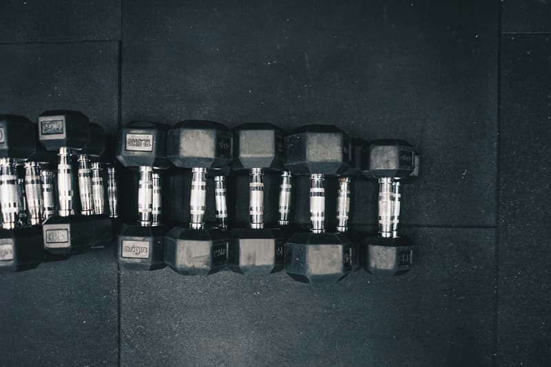 row of black hex dumbbells