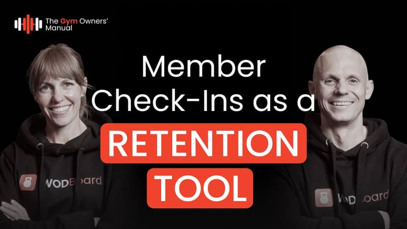 YouTube video thumbnail from The Gym Owners' Manual featuring a smiling man and woman in black WodBoard hoodies, with the text "Member Check-Ins as a RETENTION TOOL" on a black background.